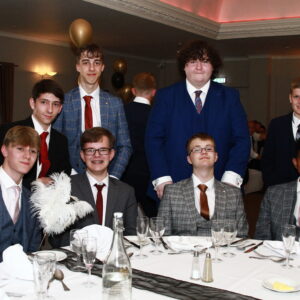 boys stood around a table