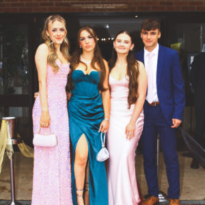 students stood by a posh car