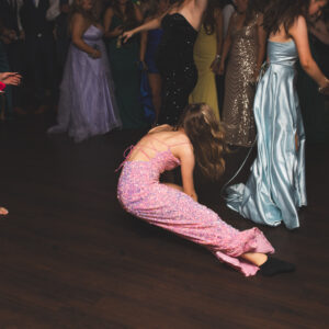 girl on the floor at prom