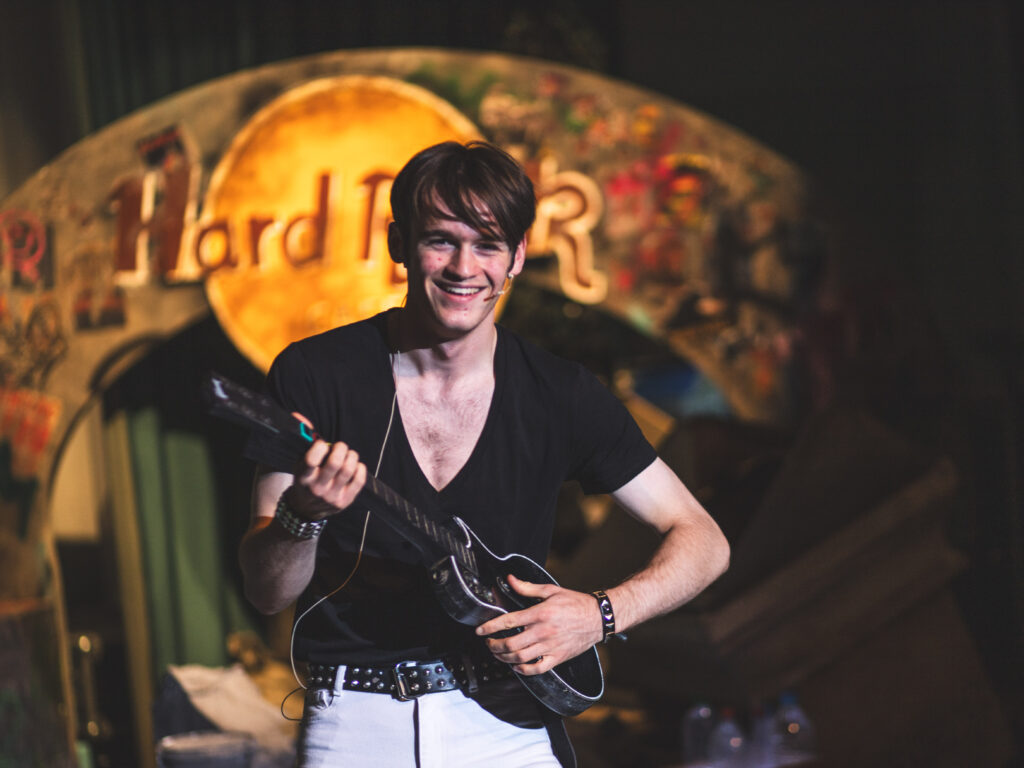 Boy playing the guitar