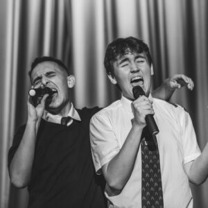 2 students singing