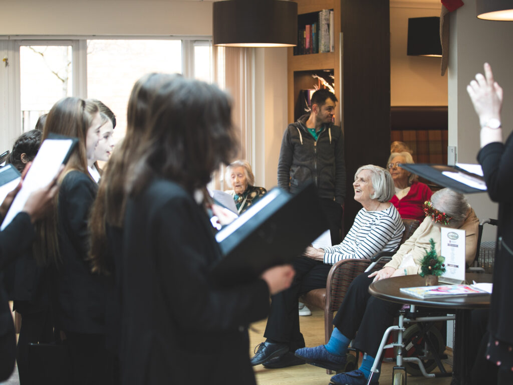 students singing in the care home