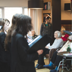 students singing in the care home