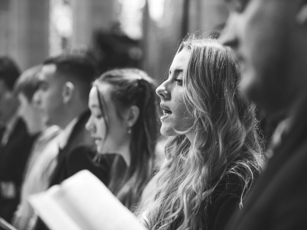 students singing, greyscale